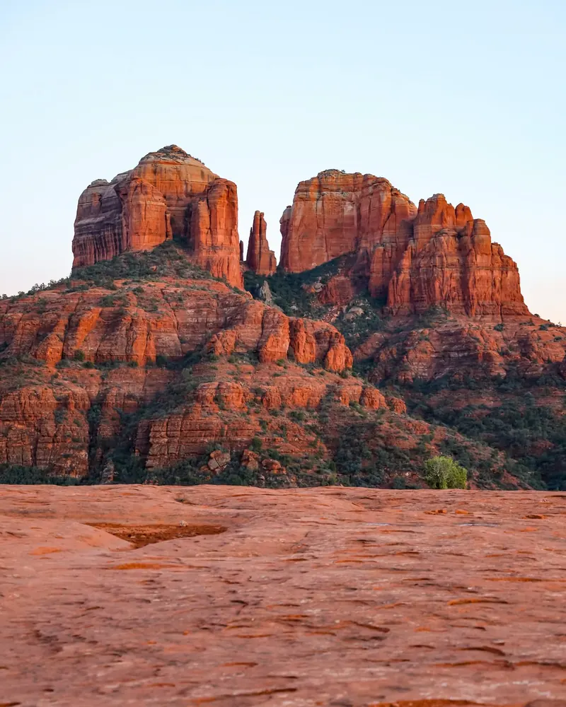 A red rock formation rising above the desert